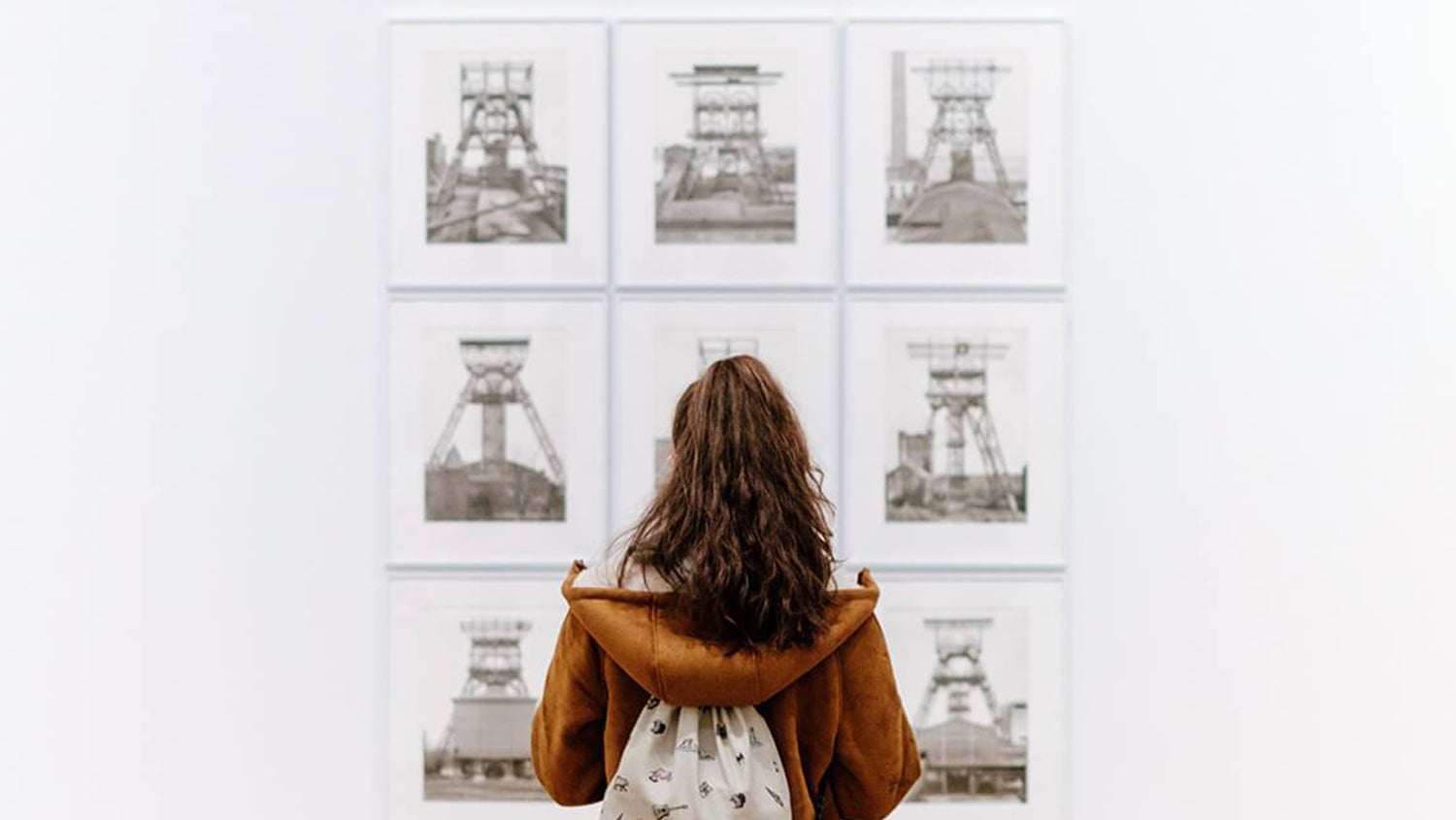 Woman Observing Art In Museum